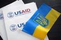 Kiev, Ukraine - 02 12 2023: USAid logo and ukrainian flag, USAid is USA agency for international development - assistance abroad Royalty Free Stock Photo