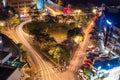 Kigali, Rwanda - August 17 2022: Roundabout in the heart of the city centre at night, surrounded by buildings Royalty Free Stock Photo