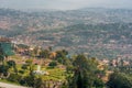 Kigali, Rwanda - September 21, 2018: A high angle view of the fountain roundabout near the city centre with rows of hills fading Royalty Free Stock Photo