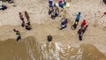 Aerial shot of a Kamaole III beach. People gather around green turtle taking sunbath Royalty Free Stock Photo