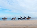 Group of horse riders on the beach Royalty Free Stock Photo