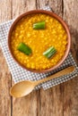 Kik Alicha Ethiopian Yellow Split Pea Stew closeup in the bowl. Vertical top view