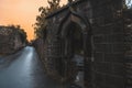 KILKENNY, IRELAND, DECEMBER 23, 2018: Spooky old stone and very wet entrance gate of a graveyard with mold and lichen growing. Royalty Free Stock Photo