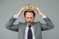 Kill your pride before you lose your head. Big boss wear crown with pride. Proud businessman grey background. Bearded