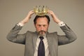 Kill your pride before you lose your head. Big boss wear crown with pride. Proud businessman grey background. Bearded