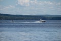 Person water skiing behind big boat on Round Lake, Ontario, Canada Royalty Free Stock Photo