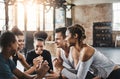 Killer glutes in the making. a group of young people doing squats together during their workout in a gym. Royalty Free Stock Photo