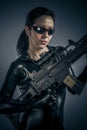 Killer, girl military woman posing with guns.