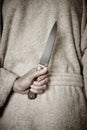 Killer woman with a knife. Violence aggression. Criminal murderer Royalty Free Stock Photo