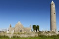 Kilmacduagh monastery with stone tower in Ireland.