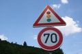 70 kilometer and traffic signal road sign, Germany.