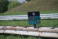 Kilometrage signs in green and speed sign on the black on the shortest highway in the Netherlands, the A38 with length of 2 km. Royalty Free Stock Photo