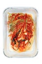 Kimchi cabbage in a glass rectangular bowl isolated in white background, top view, Korean food, copy space on right. Selective