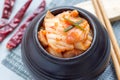 Kimchi cabbage. Korean appetizer in ceramic jar, horizontal, closeup Royalty Free Stock Photo