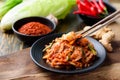 Kimchi cabbage on plate eating with chopsticks