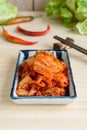 Kimchi with Chopsticks on wooden table, korean food Royalty Free Stock Photo