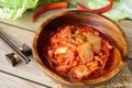 Kimchi with Chopsticks on wooden table Royalty Free Stock Photo