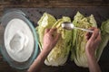 Kimchi on the stone background with Chinese chopsticks top view