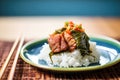 kimchi wrapped in lettuce leaf with rice and meat for ssam