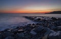 Kimmeridge Bay with wet rocks and sunset Royalty Free Stock Photo