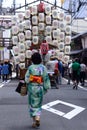 Kimono girl on the street of Gion festival, Japan.