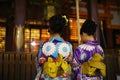 Kimono girls pray at Yasaka shrine, Kyoto