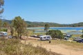 Holidaymakers Enjoying Camping Beside A Dam