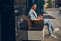 Attentive bearded man staring at his gadget