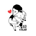 Kind child shows his love to animals and hugging a piglet. Nature respect concept and vegan lifestyle. Happy pig with
