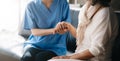 Kind nurse together with elderly woman in the hospital`s Royalty Free Stock Photo