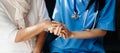 Kind nurse together with elderly woman in the hospital`s Royalty Free Stock Photo