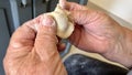 kind old hands of an elderly woman grandmother roll out the dough she will cook pies and bake something or boil Royalty Free Stock Photo