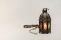 Colored Lantern with rosary beads.