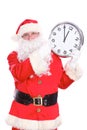 Kind Santa Claus pointing to clock, isolated on white background