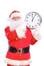 Kind Santa Claus pointing to clock, isolated on white background