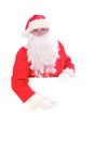 Kind Santa Claus pointing in white blank sign, isolated on white background