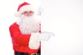 Kind Santa Claus pointing in white blank sign, isolated on white background