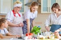 Kind Senior Woman Teach Children To Cook, Having Talk At Home In Kitchen