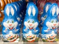 Kinder surprise chocolate bunnies in blue wrappers on display, easter concept Royalty Free Stock Photo