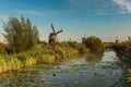 Kinderdijk canals with windmills. Sunset in Dutch village Kinder