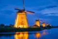 Kinderdijk National Park in the Netherlands. Windmills at dusk. A natural landscape in a historic location. Reflections on the wat