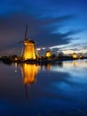 Kinderdijk National Park in the Netherlands. Windmills at dusk. A natural landscape in a historic location. Reflections on the wat