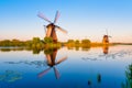Kinderdijk National Park in the Netherlands. Windmills at dusk. A natural landscape in a historic location. Reflections on the wat