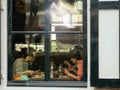 Chinese asian tourists eating in Dutch restaurant