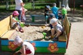 The kindergarten is central. Open Day.Children in the kindergarten play in the sandbox