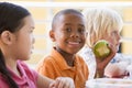 Kindergarten children eating lunch