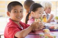 Kindergarten children eating lunch