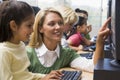 Kindergarten children learn how to use computers Royalty Free Stock Photo