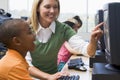 Kindergarten children learn to use computers Royalty Free Stock Photo