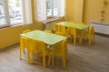 Kindergarten classroom with small chairs and tables Royalty Free Stock Photo